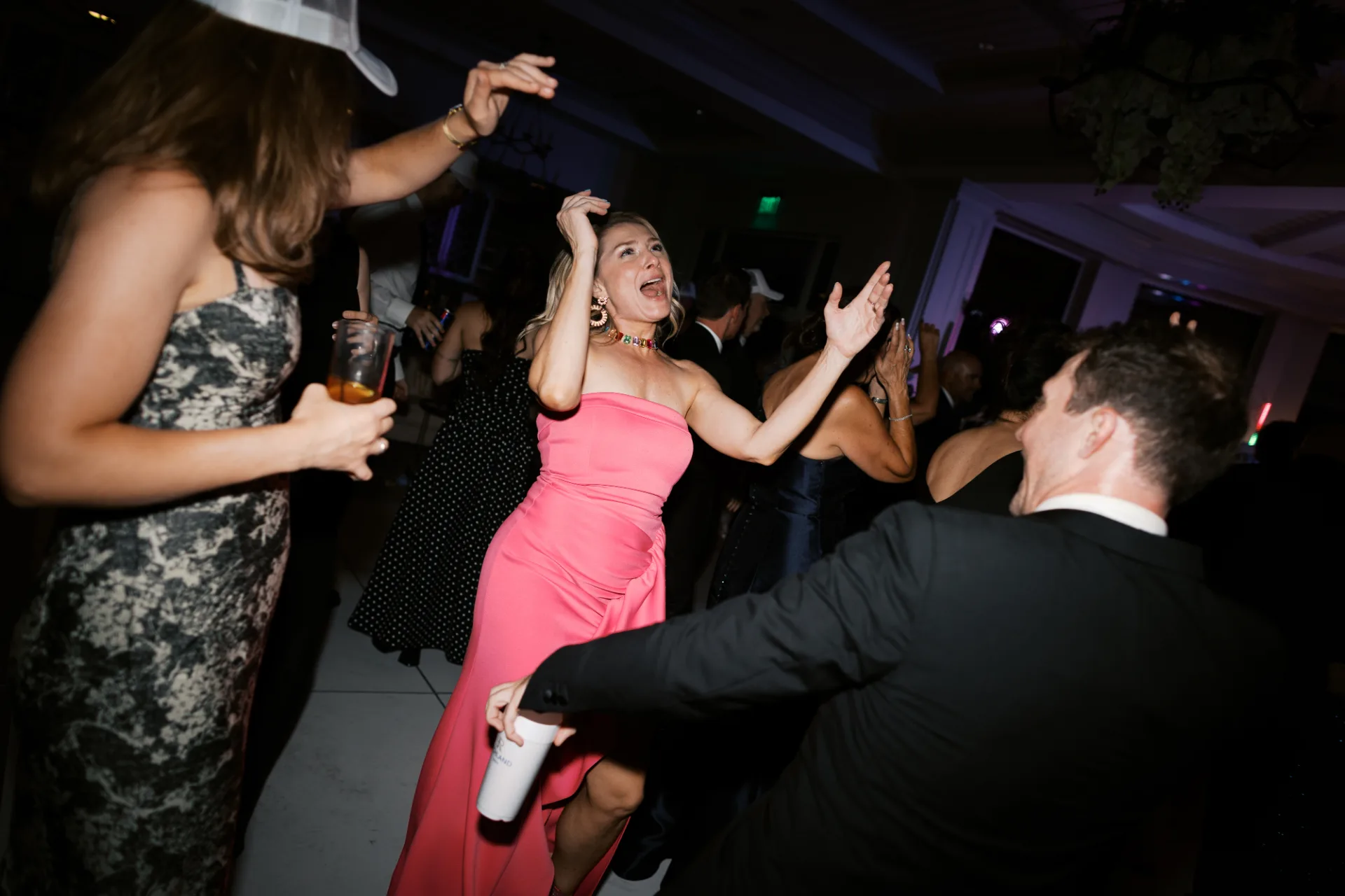 Guests dancing and celebrating together at a lively private party
