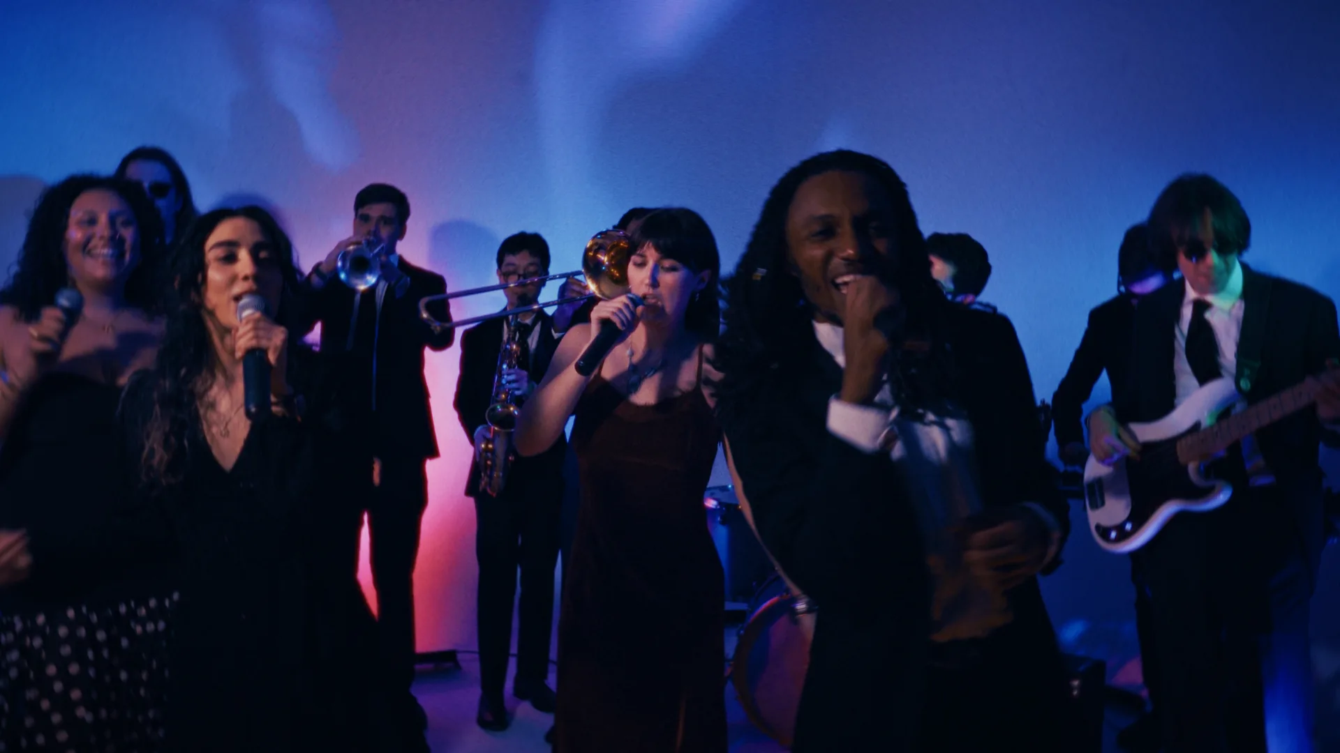 The full ten-piece collective performing live with vocalists out front